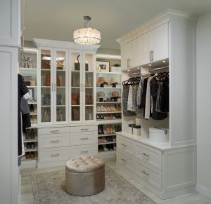Walk-in closet with custom shelving and drawers
