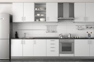 interior design of clean modern white and black kitchen with stainless steel equipment
